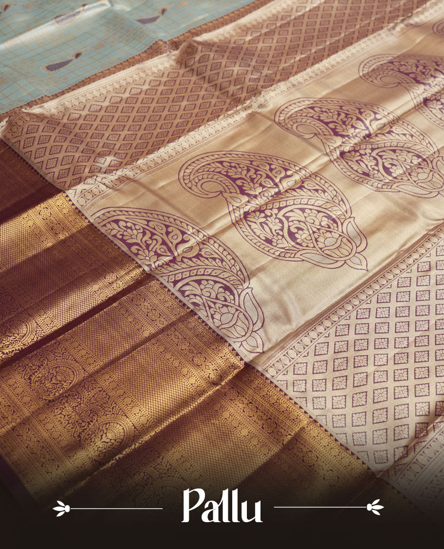 Faded blue colour and Antique gold Zari Tissue Brocade Saree features intricate check and bird Motifs on body and rich violet colour border & pallu with traditional patterns paired with contrast blouse