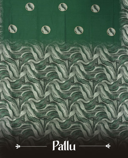 Dark green semi silk saree featuring elegant circular motifs on the body, complemented by a striking pallu adorned with intricate wavy silver thread patterns, and paired with a matching blouse