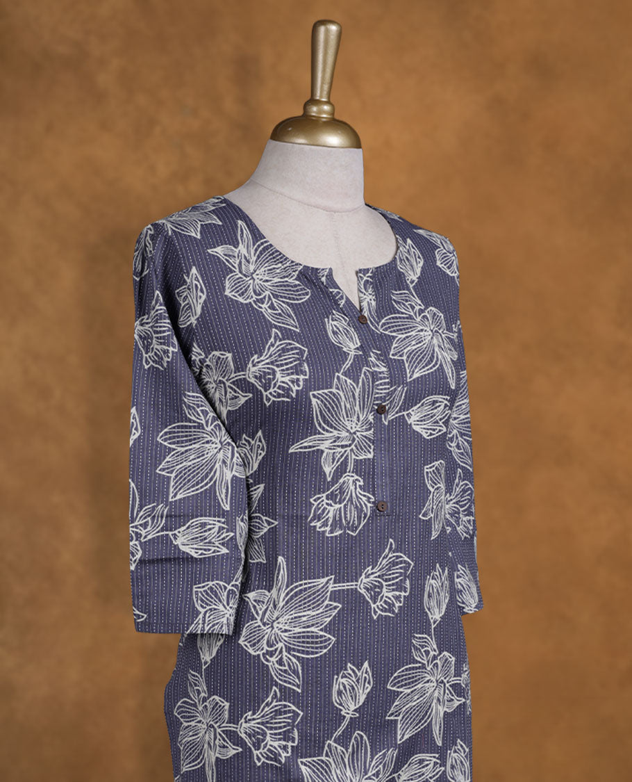 Blue Ash colour kurti adorned with white floral outlines and fine pinstripes, styled with a notched round neckline with button detailing and comfy 3/4th sleeves.