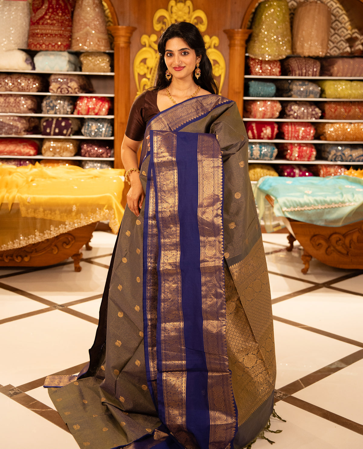 Green & Blue double shade Chettinad cotton saree featuring Gold zari strips with peacock motifs on body, complemented by contrast colour border with zari design & grand pallu, comes with matching blouse piece.