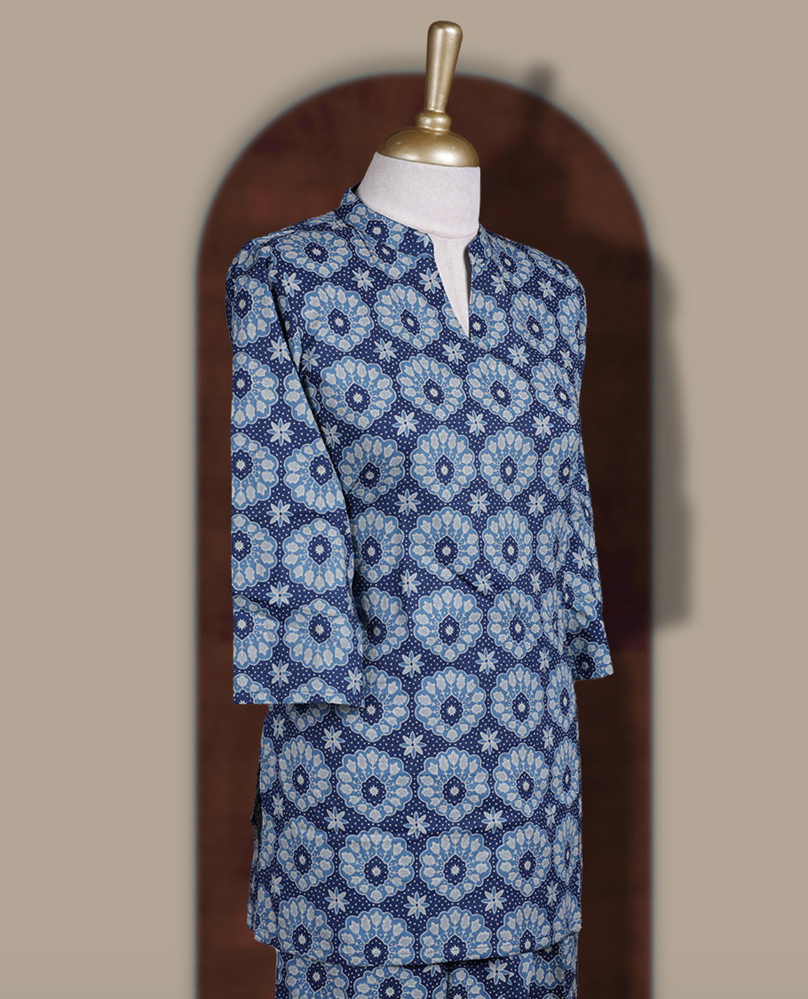 Blue colour cotton coord set with intricate all over prints, featuring a stylish mandarin collar and 3/4 sleeves, Paired with matching straight pants, it offers a perfect blend of comfort, elegance, and everyday sophistication.