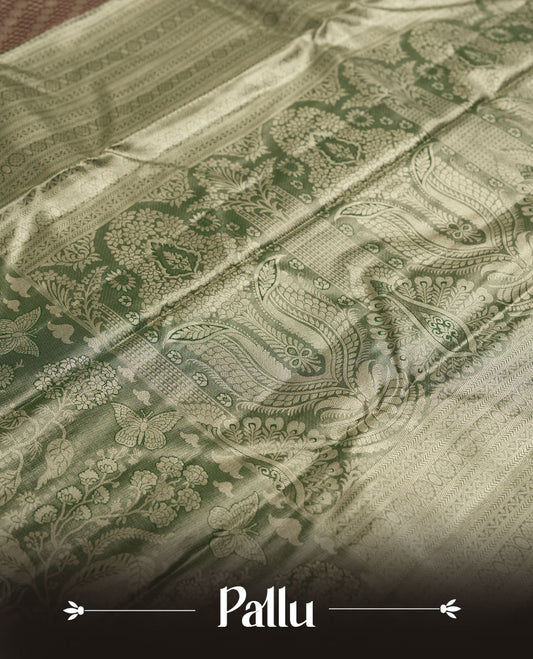 brick red colour and Antique gold Zari Tissue Brocade Saree features intricate Motifs on body and a dark green colour with fancy border & pallu with floral patterns, paired with matching blouse