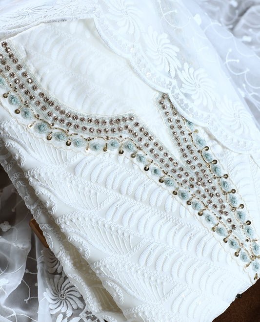 White colour churidhar material featuring delicate embroidery with blue colour sequins and bead highlights, paired with a plain white bottom & Comes with a matching embroidered net dupatta.