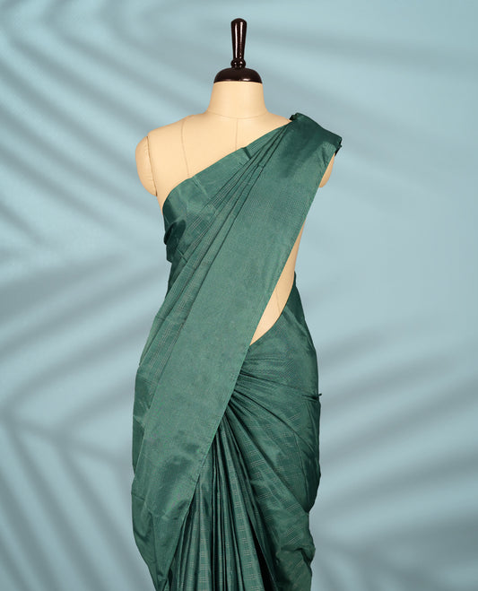 Pastel teal green Colour semi silk saree features subtle Silver zari check patterns throughout and Self Colour border, comes with a matching blouse