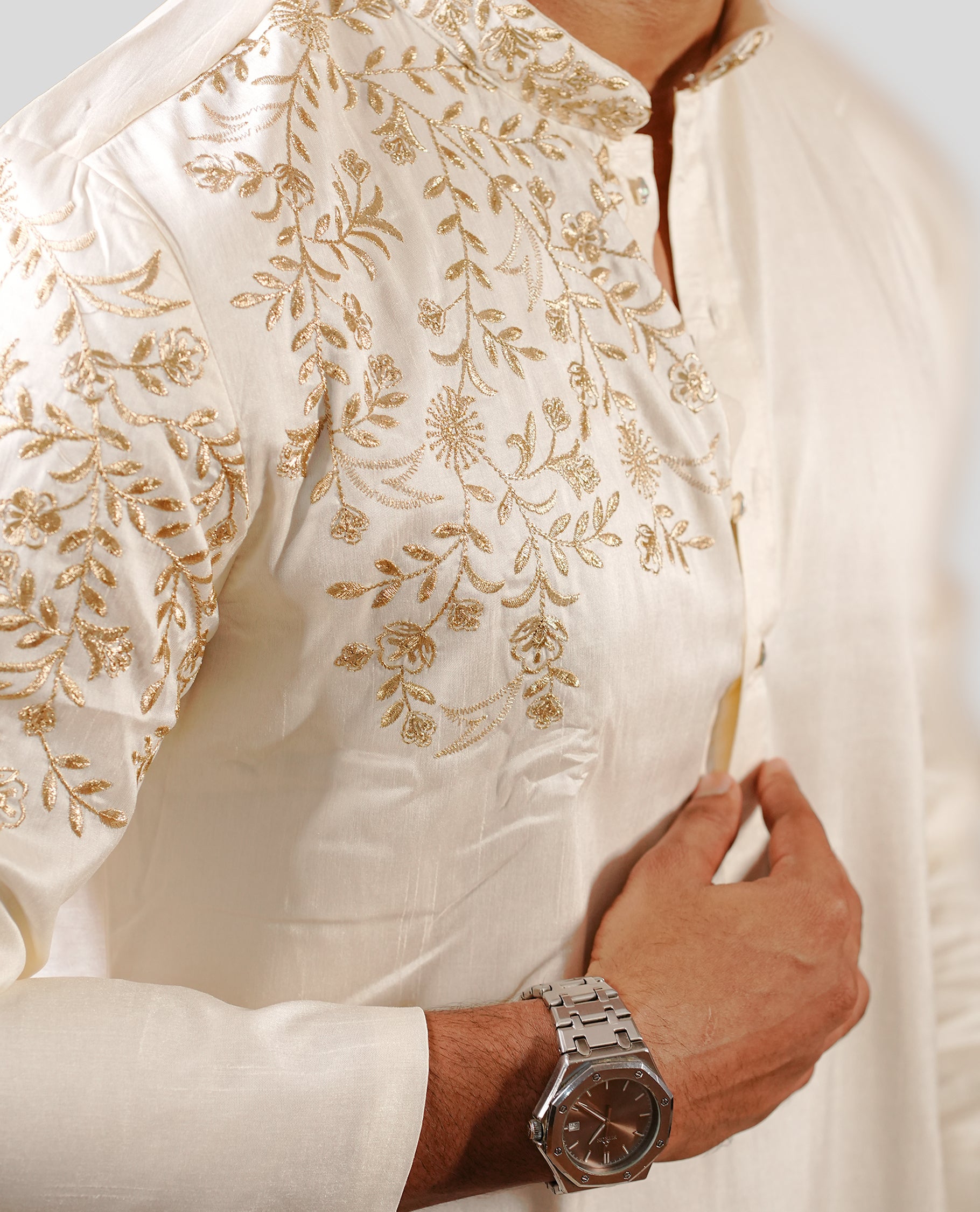 Cream colour men's kurta featuring elegant gold thread work on the body, complemented by full sleeves for a refined and festive look.