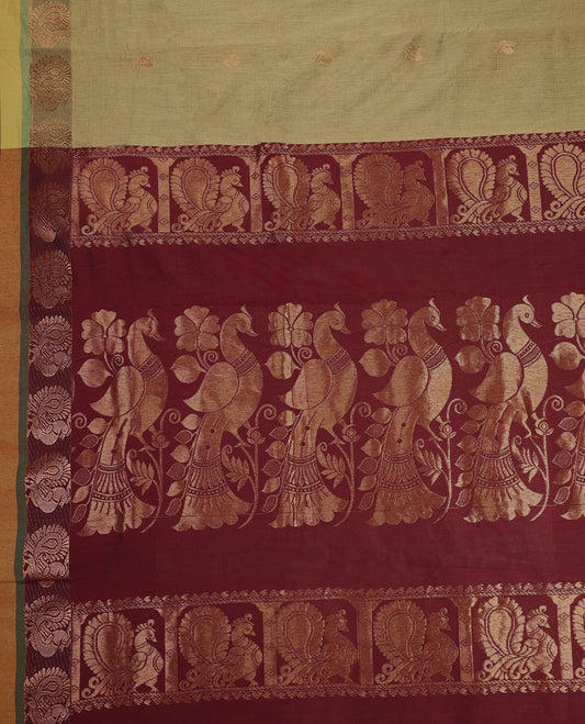 Olive Green and Maroon Kalyani cotton saree featuring subtle woven motifs on the body, accentuated with rich zari peacock designs on the border and pallu, paired with a matching blouse.