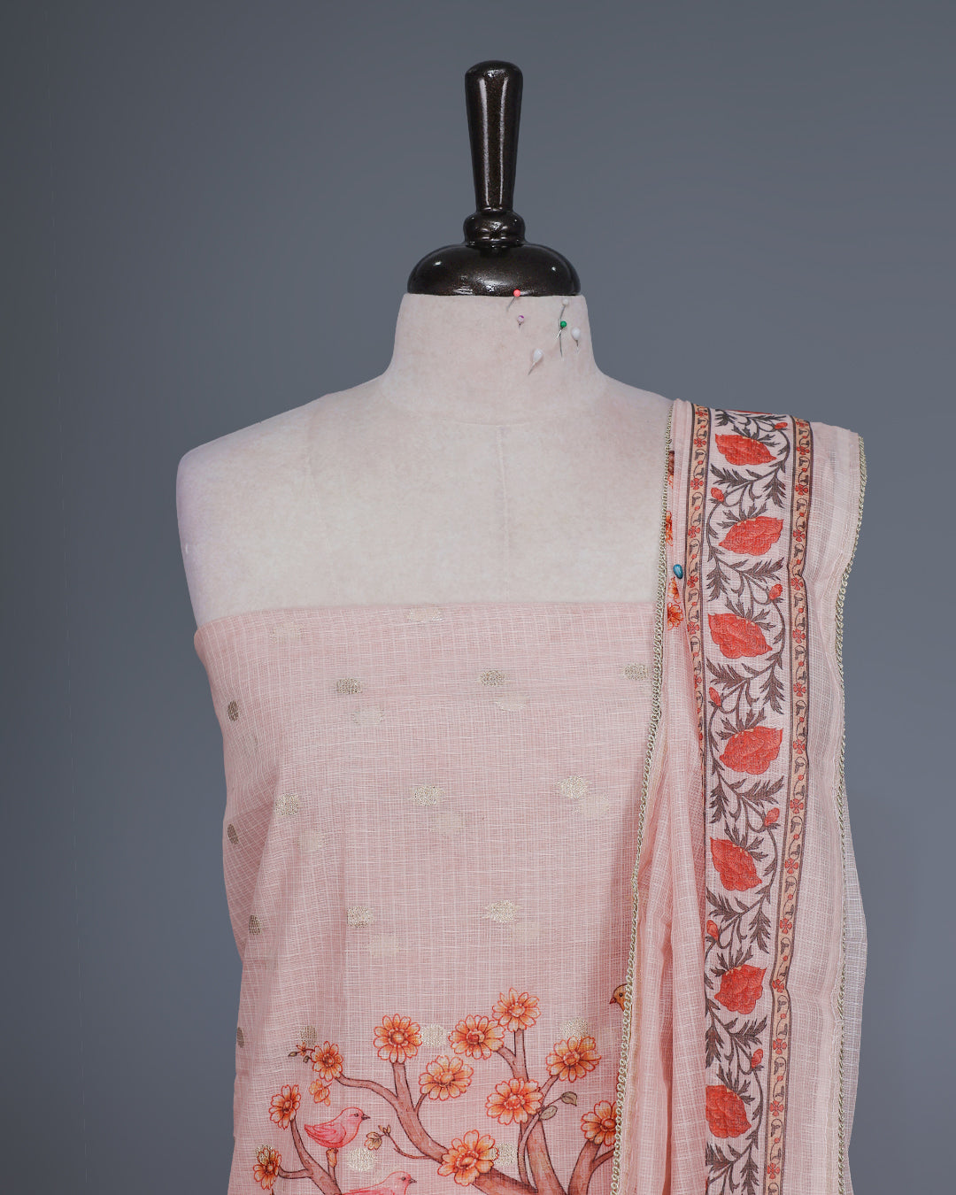Light pink Colour Kotta Net Salwar material featuring a beautiful Radha inspired digital print with floral motifs and subtle golden accents on body , paired with a matching bottom and dupatta.