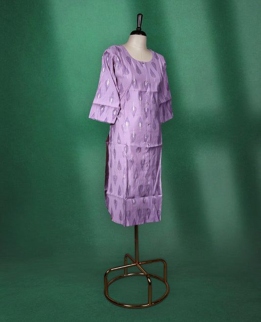 Lavender colour cotton kurti adorned with metallic silver leaf motifs, featuring a round neckline, front button placket, and elbow length sleeves a perfect blend of subtle shine and everyday comfort.