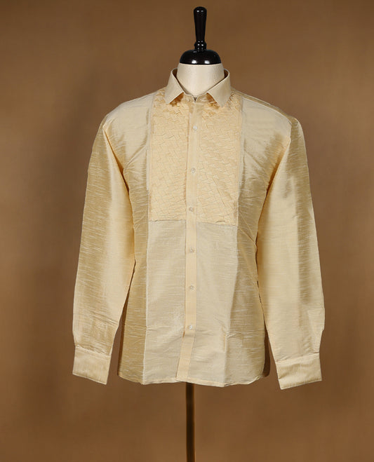 Cream ivory DH men's semi silk wedding shirt with a glossy finish, featuring intricate diamond jacquard pleats on the front panel, full sleeves, classic collar, and a chest pocket.
