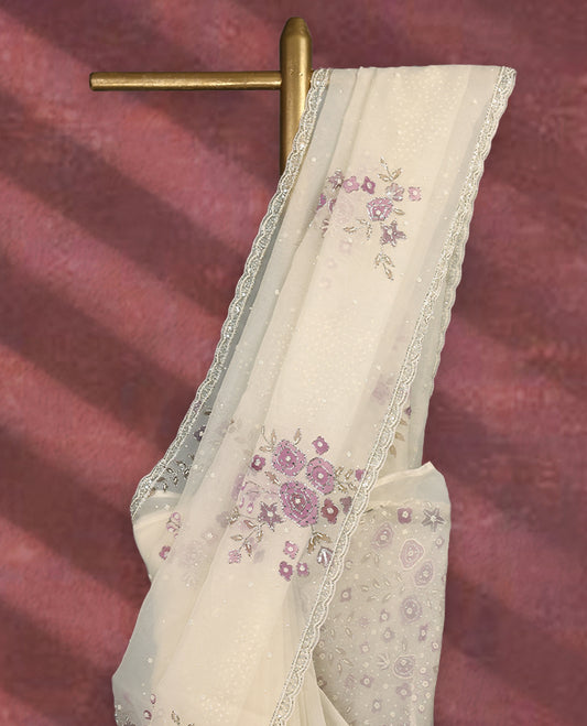 White colour pure organza saree featuring Light Purple floral prints with intricate bead and sequin work across the body, adorned with a matching embellished border, complemented by a worked pallu and paired with a heavily worked matching blouse.