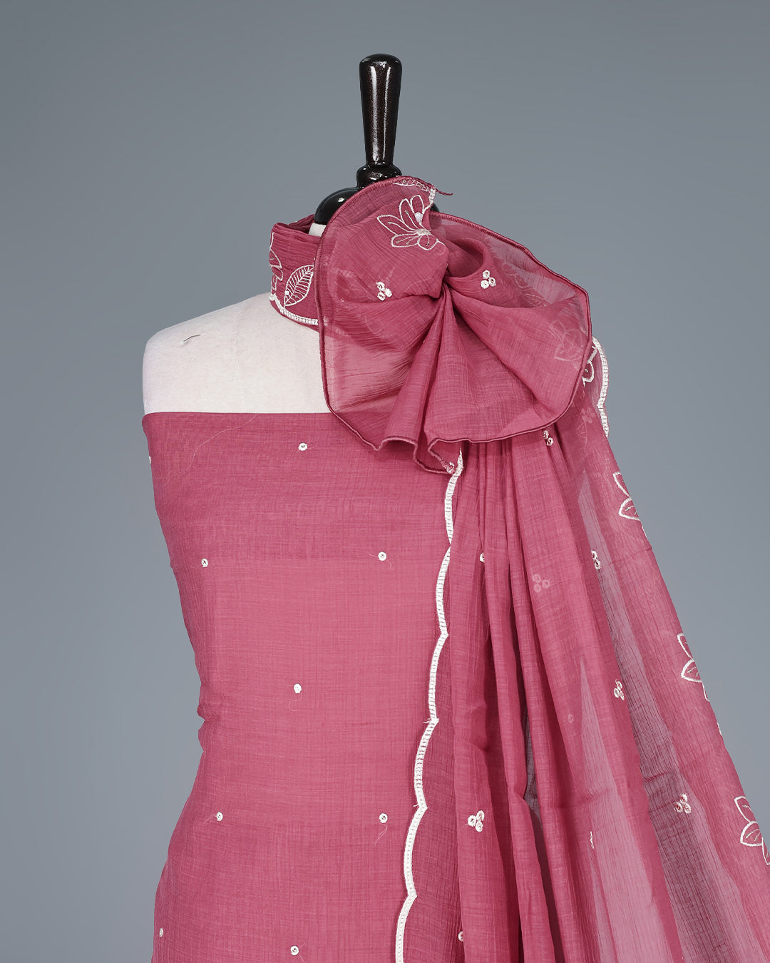 Rose mauve Colour Mul Chanderi Salwar Material Featuring Elegant White Floral Thread Embroidery on the Kurta, paired with a matching bottom & graceful embroidered Dupatta.