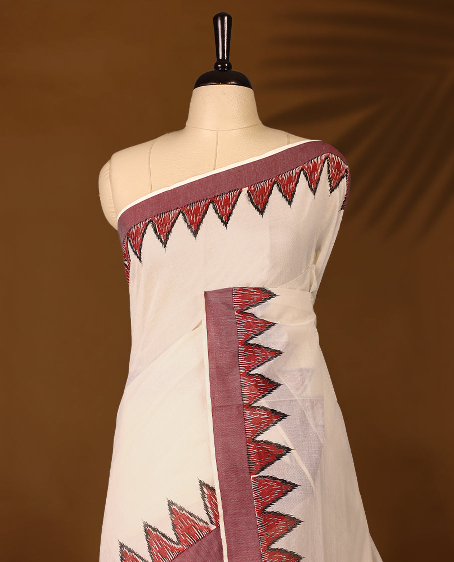Elegant off white colour cotton Kerala saree featuring Plain body, deep Maroon colour border with temple designs, Paired with matching blouse offering a classic and graceful look, paired with a matching blouse.