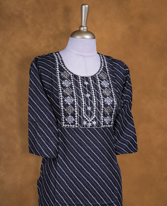 Black colour kurti with styled with a thread pattern around neckline, print pattern across body, knee length design, and a sleeve.