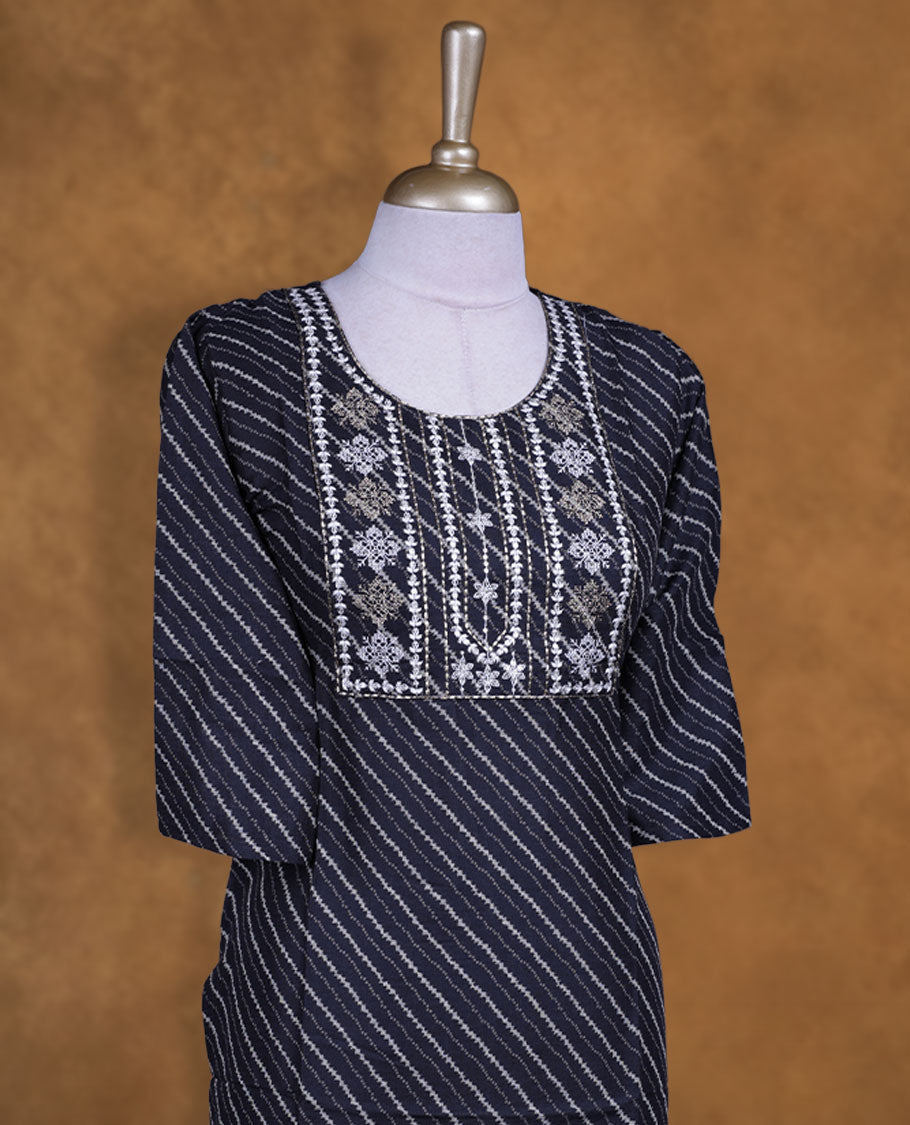 Black colour kurti with styled with a thread pattern around neckline, print pattern across body, knee length design, and a sleeve.