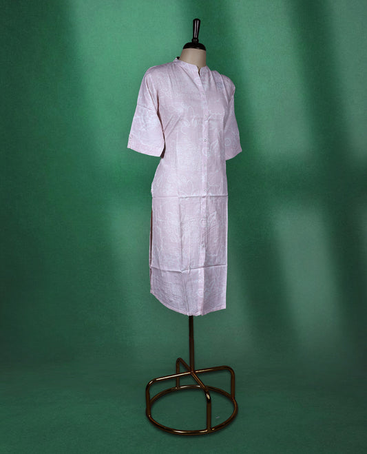 Baby pink colour cotton kurti with subtle self printed floral patterns, featuring a mandarin collar, front button down design, and elbow length sleeves a soft and graceful choice for everyday elegance.