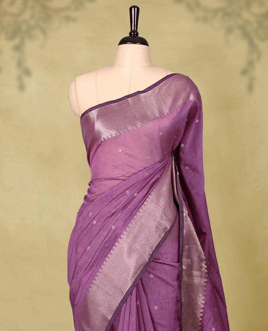 Pastel Purple colour Chanderi cotton saree adorned with delicate Golden Flower motifs on the body, paired with a traditional Mangalagiri style golden zari border with matching blouse.