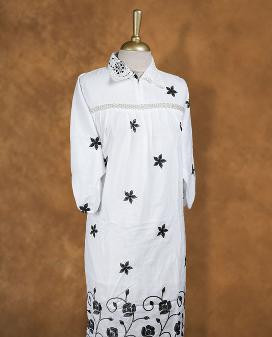 White embroidered nightwear kurti with contrast black floral motifs, crochet-detailed shirt collar, front yoke gathers, and three-quarter sleeves with elasticated hem