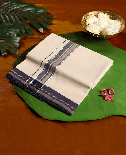 Off white colour pure handloom double dhoti featuring an elegant navy blue kara with golden zari stripes and fine line detailing, woven with precision for comfort and durability, perfect for traditional and festive occasions