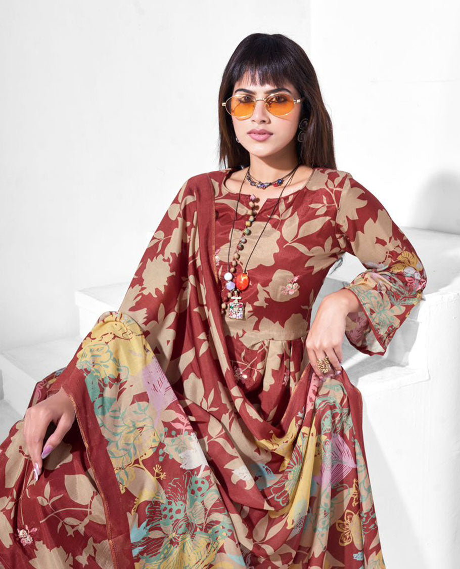 Rust maroon colour pure muslin suit set featuring beige digital floral printed top featuring sequin butti embroidery and a scalloped floral embroidered border, paired with a dyed pure viscose muslin bottom and a digital printed dupatta.