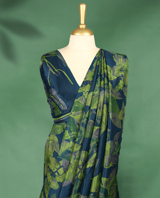 Deep navy colour Manipuri saree featuring oversized lime green and olive floral motifs, finished without a border, and paired with a matching blouse.
