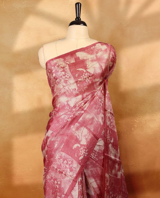 Deep pink colour pure tussar silk light weight saree with full body abstract floral print, no defined border and pallu, paired with matching abstract printed blouse.