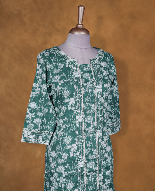 Teal green colour floral printed kurti by Talisha with round notch neckline, straight calf‑length silhouette, vertical pintuck detailing on the front, and three‑quarter sleeves with contrast printed cuffs.