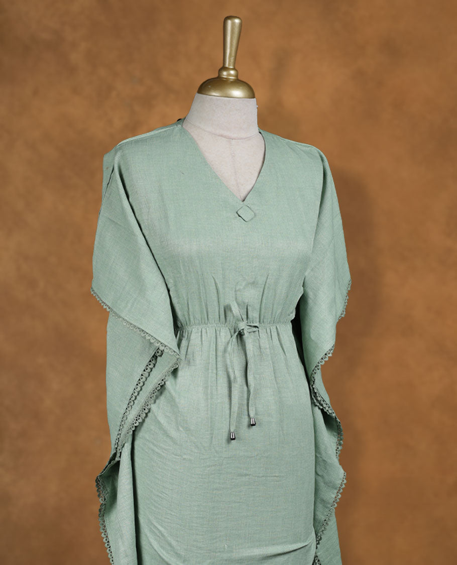 Sage green kaftan-style nightwear dress with V-neckline, drawstring waist tie, relaxed draped sleeves, and lace-detailed edges.