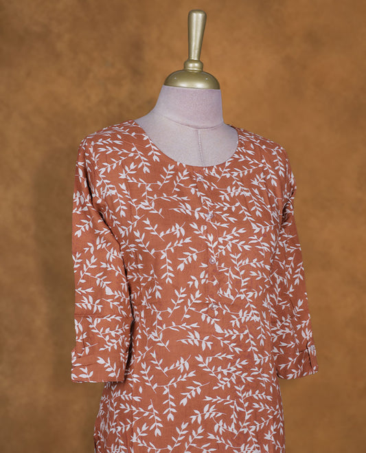 Brown and white colour kurti with White floral prints, knee length design, styled with a round neckline and a sleeve .