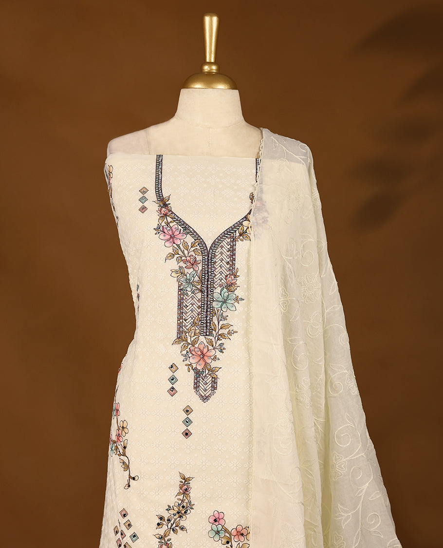 Off-white threadwork top with multi-colour prints and border, paired with a bottom and an embroidered dupatta.