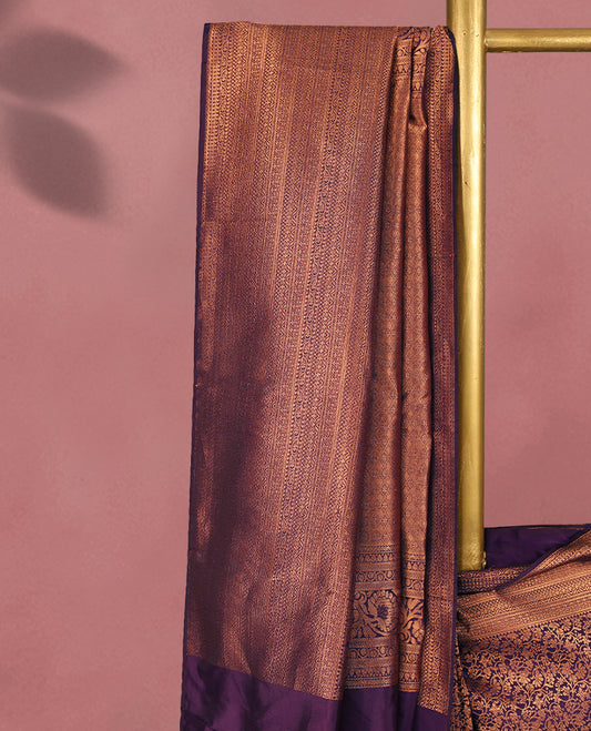 Royal Purple colour Kancheepuram saree featuring an antique zari brocade body, complemented by a traditional border and a matching blouse.