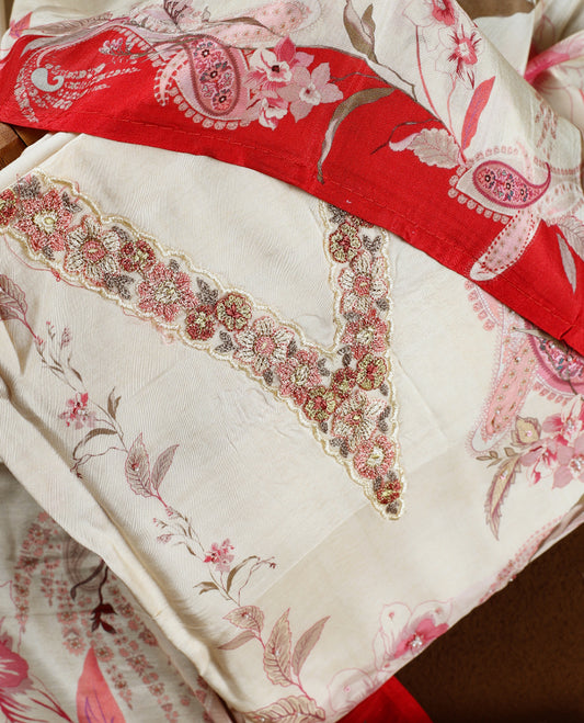 Cream colour churidhar material with pink floral and paisley prints, detailed embroidery, and a striking maroon border and Comes with a plain matching bottom and dupatta.