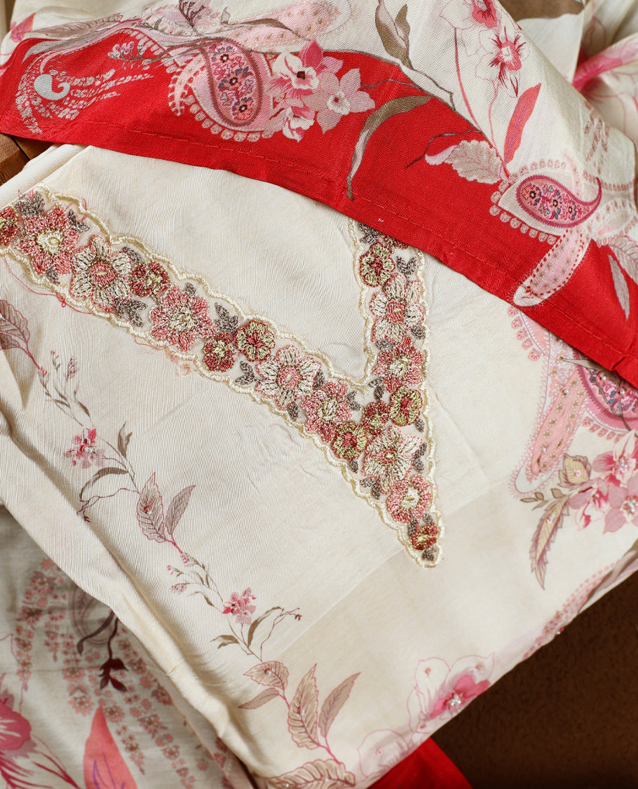 Cream colour churidhar material with pink floral and paisley prints, detailed embroidery, and a striking maroon border and Comes with a plain matching bottom and dupatta.