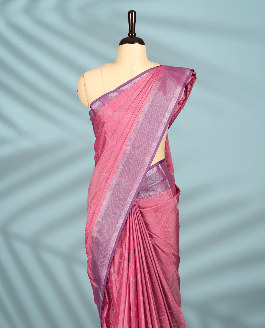 Rose pink Colour semi silk saree features delicate silver thread checks all over, paired with a Plum Colour zari border and a matching blouse