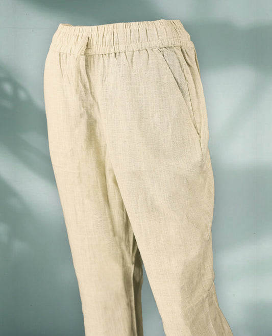 Beige Colour women's pants feature a lightweight, textured fabric with an elastic drawstring waistband and tapered ankle length fit