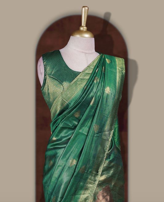 Gold and Green colour Dhavani set featuring a Gold colour skirt with contrast Green colour border with rich gold zari pattern, paired with a contrasting Green dupatta detailed with gold motifs