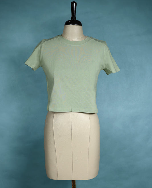 Pastel Green short sleeve T shirt with a round neck, featuring subtle stud detailing on the shoulders for a sleek, edgy twist on everyday comfort.