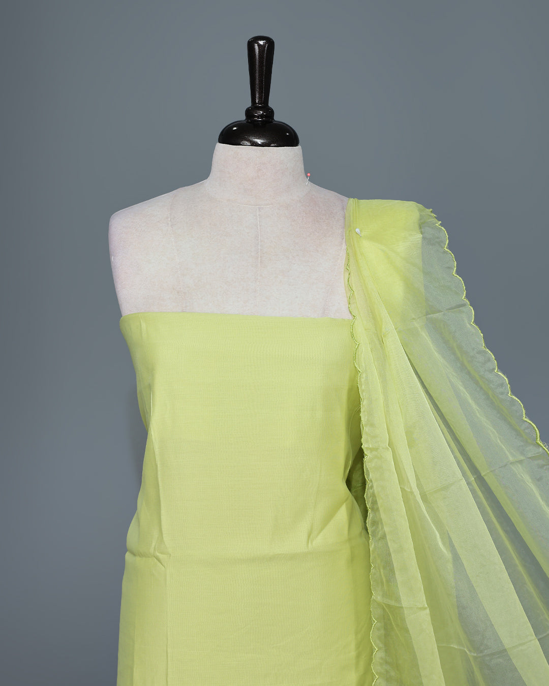 Lemon Yellow Colour Mul Chanderi Salwar Material paired with a matching bottom and a graceful floral embroidered organza dupatta.