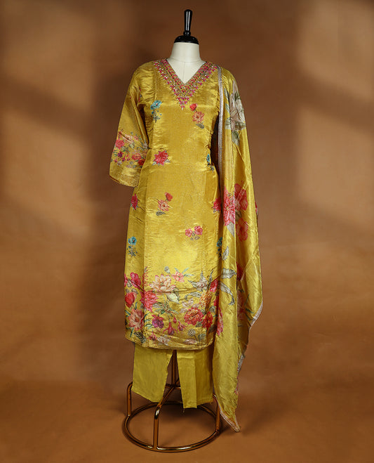 Mustard yellow colour salwar from TWARA, featuring a V-neck adorned with cut beads, sequins, and thread work, with digital floral prints on the top, paired with a matching bottom and a digital printed dupatta.