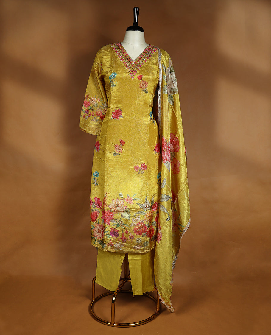 Mustard yellow colour salwar from TWARA, featuring a V-neck adorned with cut beads, sequins, and thread work, with digital floral prints on the top, paired with a matching bottom and a digital printed dupatta.
