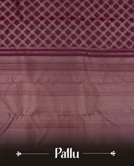 Dark wine colour Kanchipuram pattern Manthrakodi saree adorned with diamond antique gold zari jacquard on the body, highlighted by a rich geometrical pattern border and complemented with a self jacquard blouse piece.
