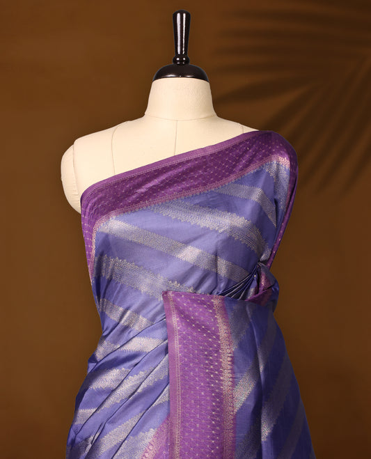 Pastel purle colour saree having fold zari stripes all over the body paired with purple colour border and matching blouse