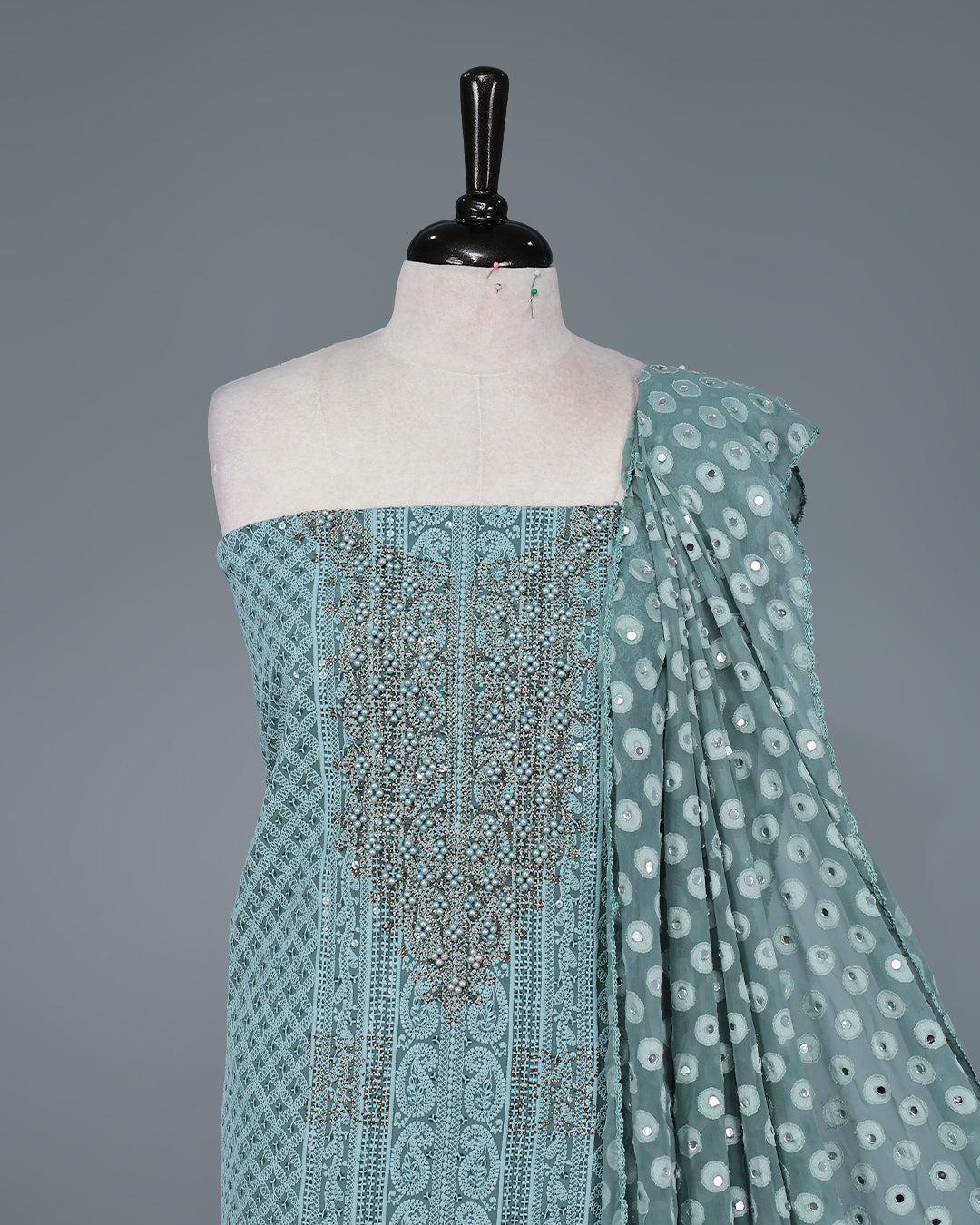 Sea Green Colour Georgette Salwar Material featuring elegant Chikankari work on the kurta, paired with a matching bottom and a sequins-embellished dupatta.