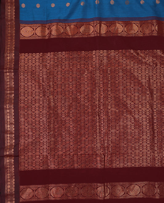 Blue colour mixed Kalyani cotton saree featuring Copper zari Bindi motifs throughout the body, paired with Maroon colour traditional border and pallu, with matching blouse