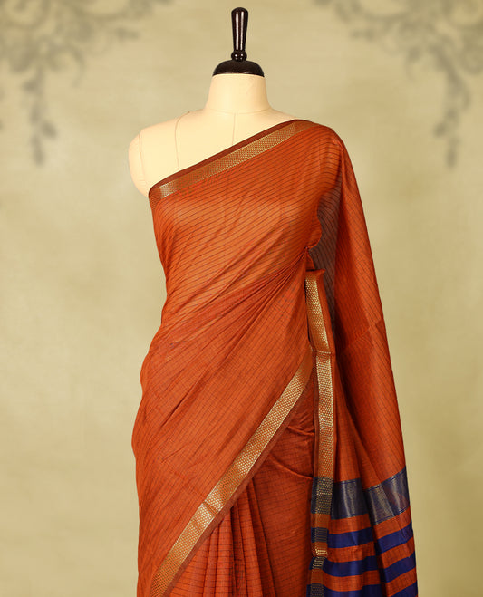 Deep Orange colour chanderi cotton saree with fine striped body, mangalgiri border, grand pallu featuring Blue and gold zari stripes, with matching blouse.