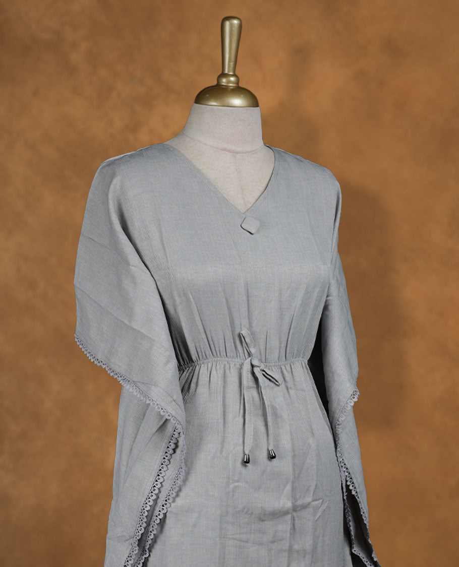 Steel grey kaftan-style nightwear dress with V-neckline, drawstring waist tie, relaxed draped sleeves, and lace-detailed edges.