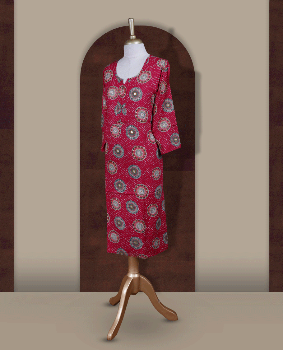Magenta colour straight cut kurthi featuring elegant circular ethnic prints, styled with a round V notch neckline and comfortable 3/4th sleeves.