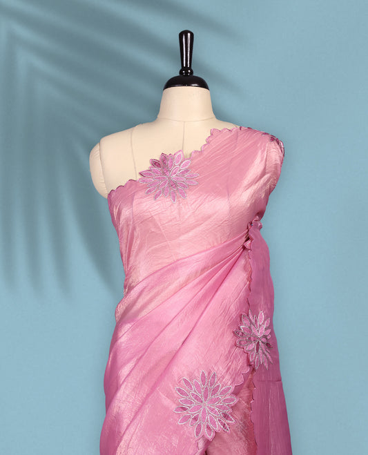 Pink colour crush soft silk saree adorned with bold floral thread embroidery on the body and scallop edged borders, Paired with a matching blouse for a complete look.