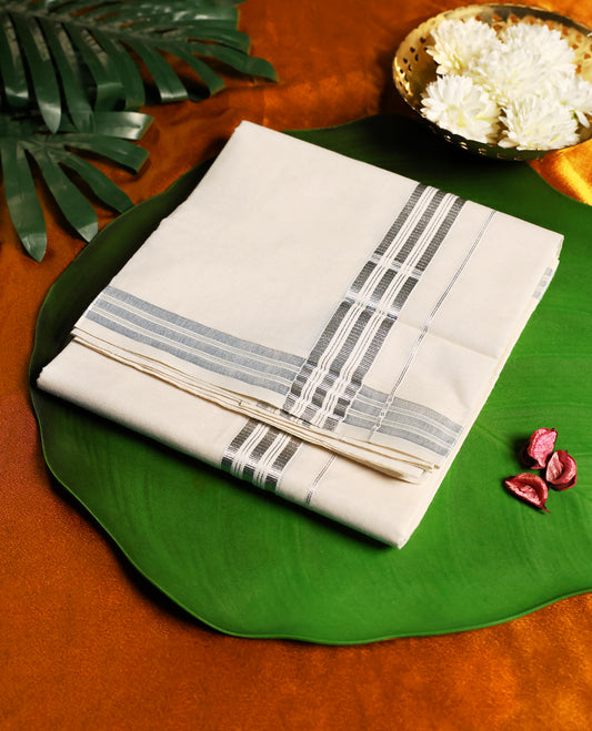 Elegant off white colour pure cotton dhoti accented with a refined silver zari border, blending simplicity with tradition, ideal for temple wear, festive occasions, and cultural celebrations.