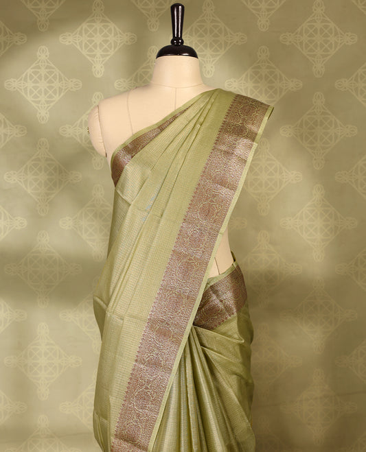 Pastel olive colour pure Banaras tussar silk saree with light gold zari small checked body, Self colour border featuring copper and silver antique zari traditional work, antique zari brocade pallu, with matching blouse.