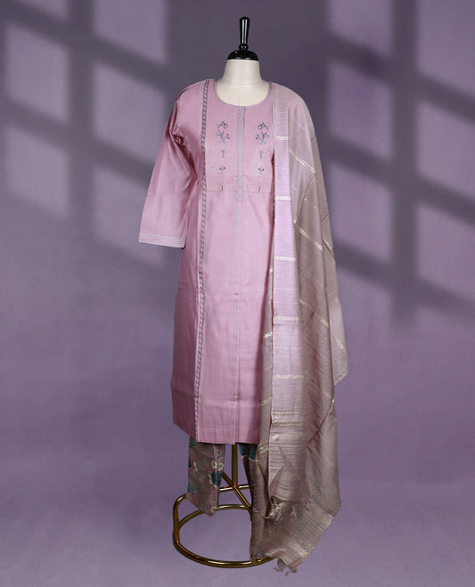 Elegant mauve colour kurti set featuring a round neckline, subtle floral embroidery on the yoke, and delicate stitch detailing, Paired with floral printed pants and a shimmering dupatta with soft golden zari stripes for a refined finish.